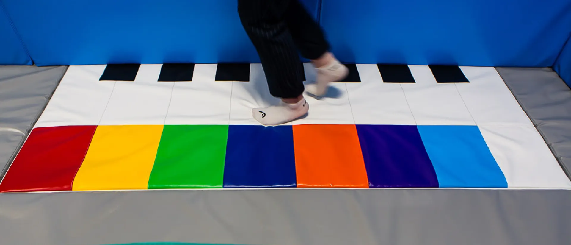 Learning fine motor skills in a soft play room.
