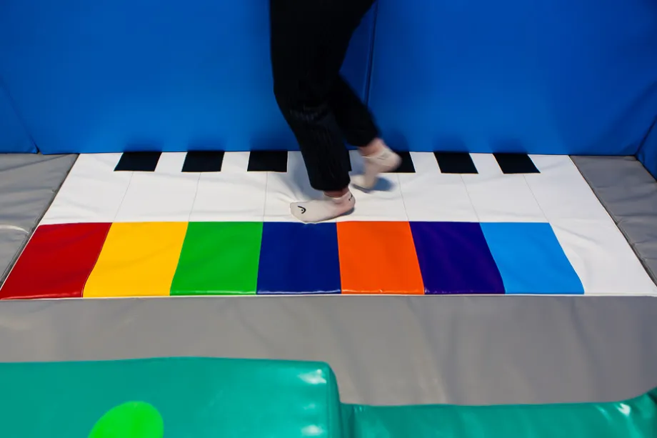 Learning fine motor skills in a soft play room.