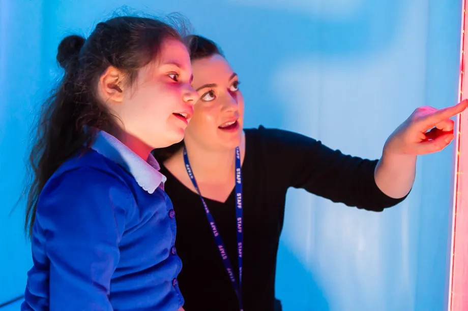 A student learning sensory skills.