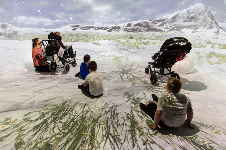 Students enjoying an arctic immersive experience room.